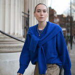 Image of model wearing Antonia Guise Jewellery ascending steps 