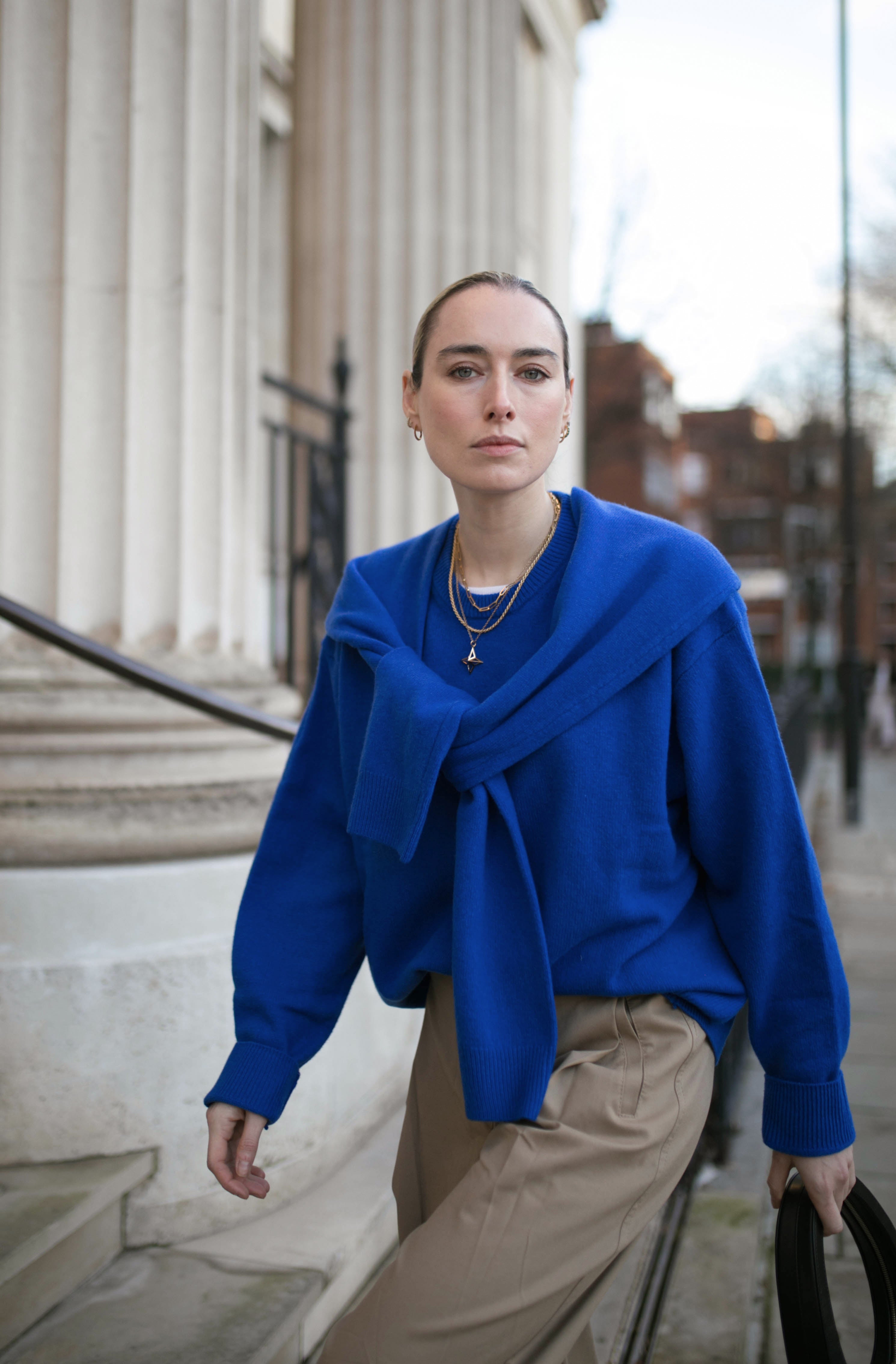 Image of model wearing Antonia Guise Jewellery ascending steps 