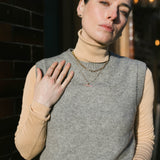 Model in the sun wearing our T-bar Necklace inspired by Marlene Dietrich. 