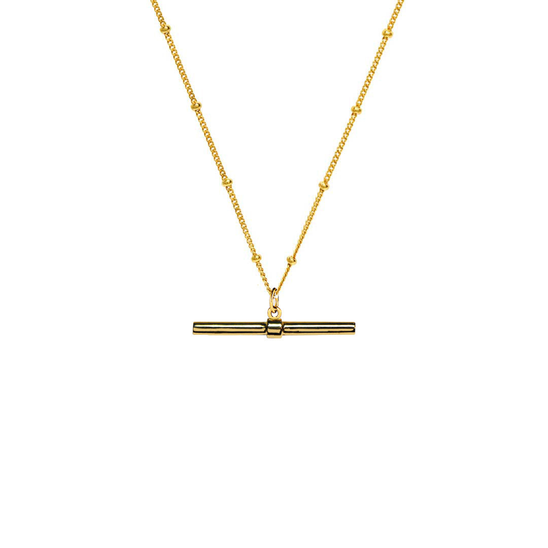Marlene T-Bar Necklace hanging on gold chain on white background