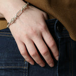Model wearing jeans and silver Artemisia Chain with hands in her pocket