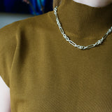 Model wearing mustard knitting top and silver Artemisia Necklace