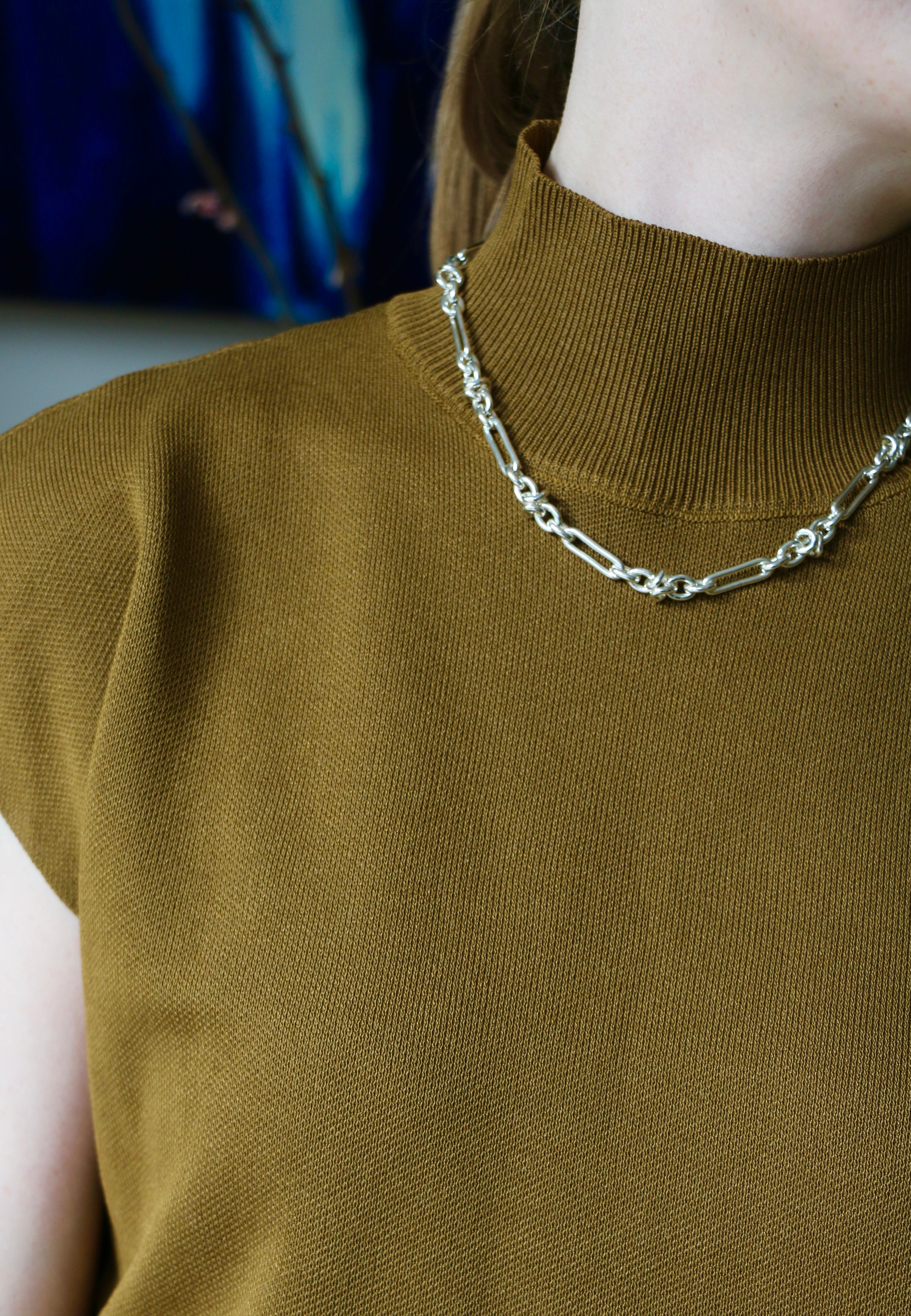Model wearing mustard knitting top and silver Artemisia Necklace