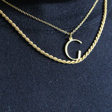 G initial Necklace and Rosalind Chain worn by model wearing blue polar neck