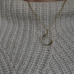 O Gold Necklace worn by model wearing white knitted jumper