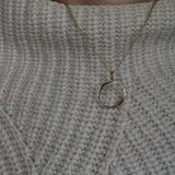 O Gold Necklace worn by model wearing white knitted jumper