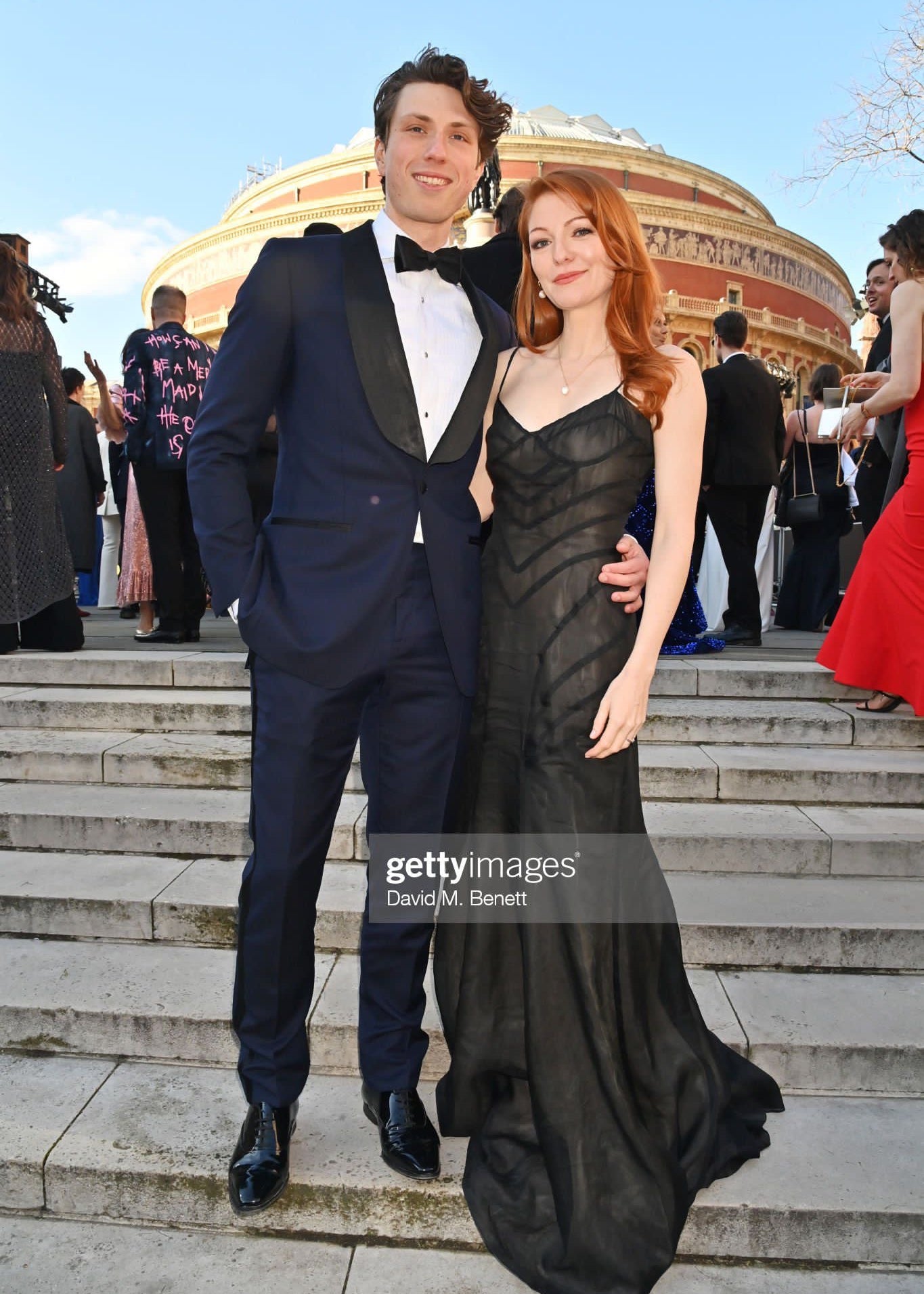 Image of Laura Pitt Pulford at the Olivier Awards 2023 wearing our Anne Pearl Necklace and Hedy Pearl drop earrings. She's stood on the steps outside of the Royal Albert Hall in a black dress.