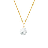 Anna Pearl Necklace hanging on white background