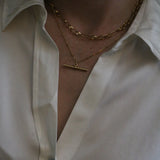 Close up of model wearing a silk white shirt and our 18 inch Marlene T-Bar Necklace 