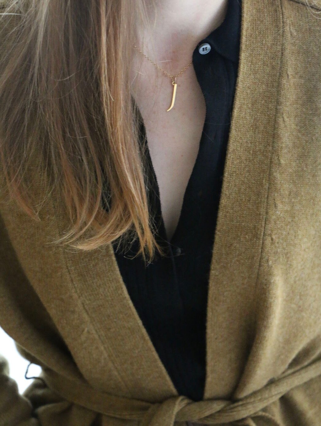 J Initial Necklace worn by model wearing woollen cardigan and black collared top