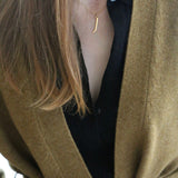 J Initial Necklace worn by model wearing woollen cardigan and black collared top