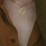 Close up of M alphabet Necklace