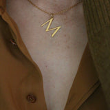 Close up of M alphabet Necklace