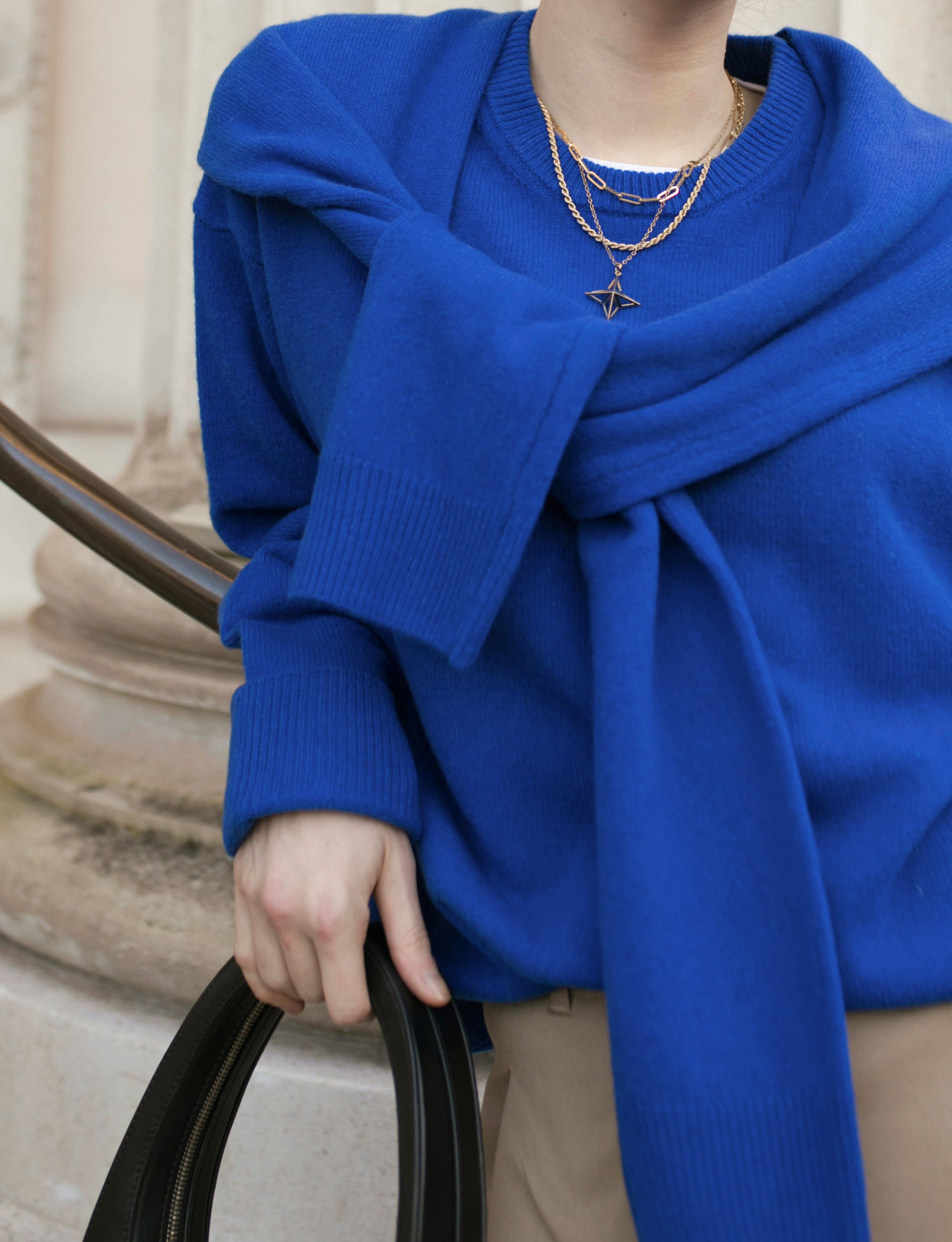 A close up of model wearing a blue jumper and Theodora Gold Vermeil Necklace