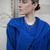Image of model wearing a stack of Antonia Guise Gold Vermeil Necklaces, including our Jenny Trace Chain