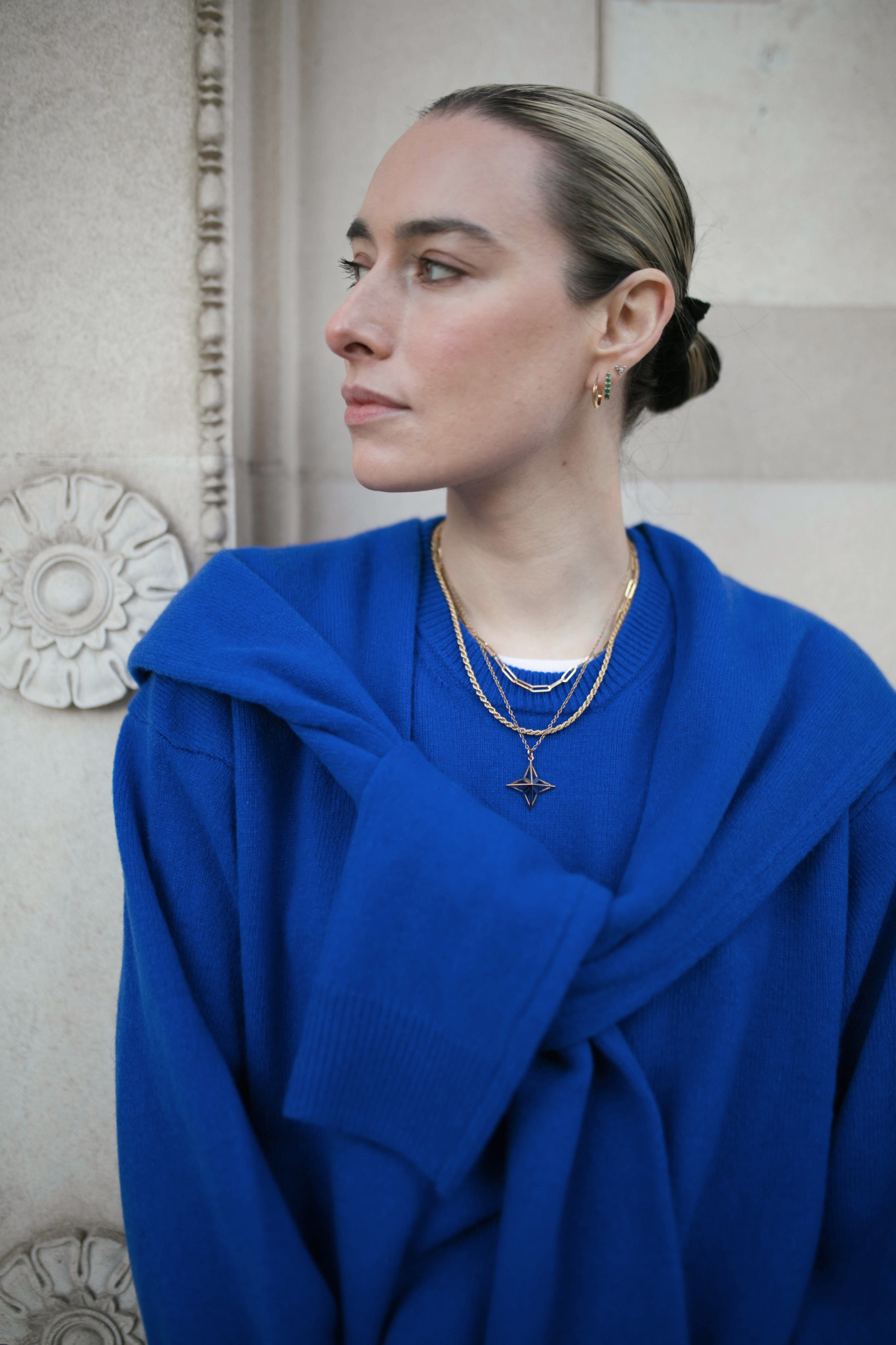 Image of model wearing a stack of Antonia Guise Gold Vermeil Necklaces, including our Jenny Trace Chain