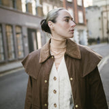 Model on Bermondsey Street wearing our handmade Mary Figaro Chain layered with other Antonia Guise Necklaces