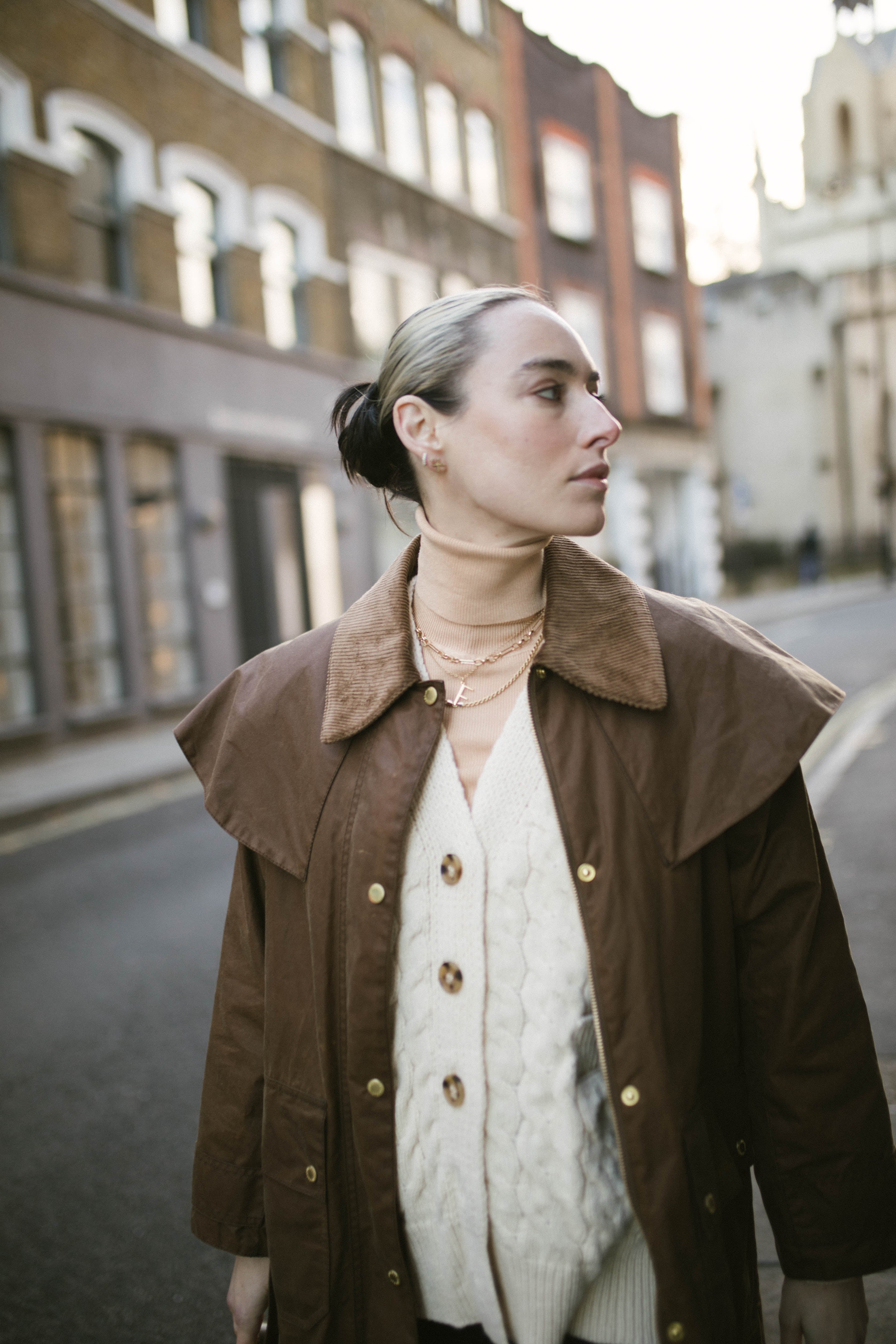 Model on Bermondsey Street wearing our handmade Mary Figaro Chain layered with other Antonia Guise Necklaces