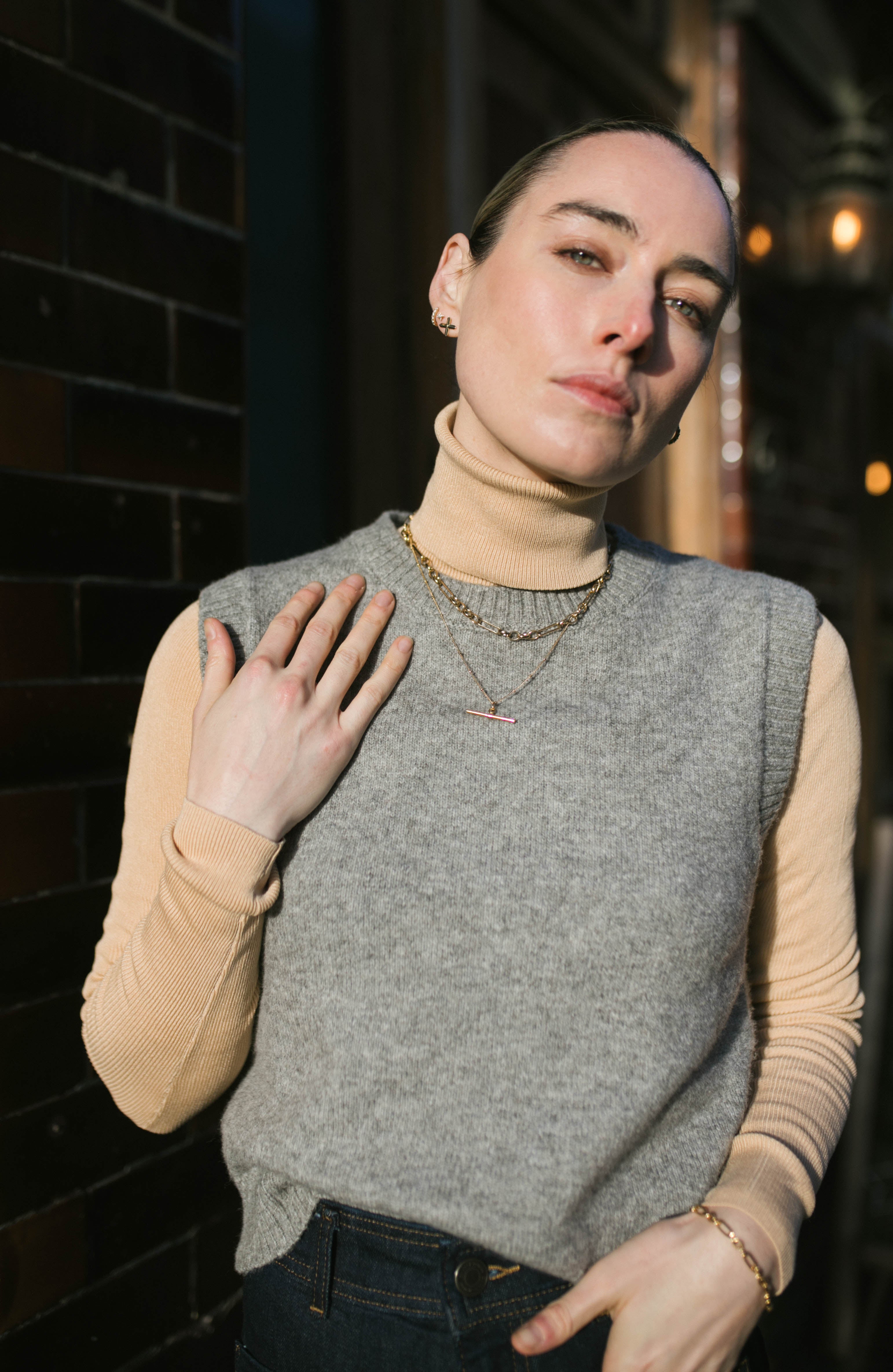 Model in the sun wearing our T-bar Necklace inspired by Marlene Dietrich. 