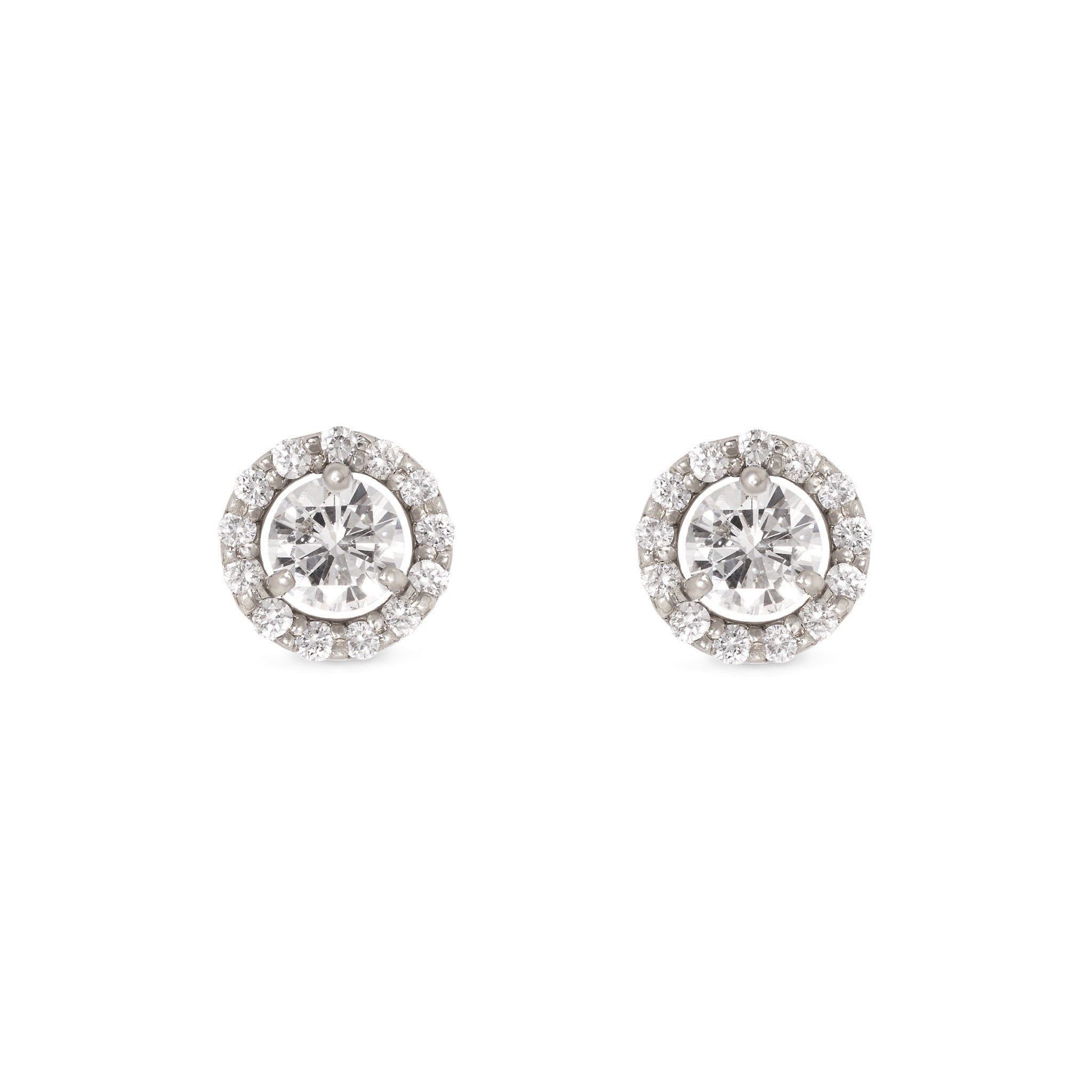 Pair of diamond halo studs on a white background