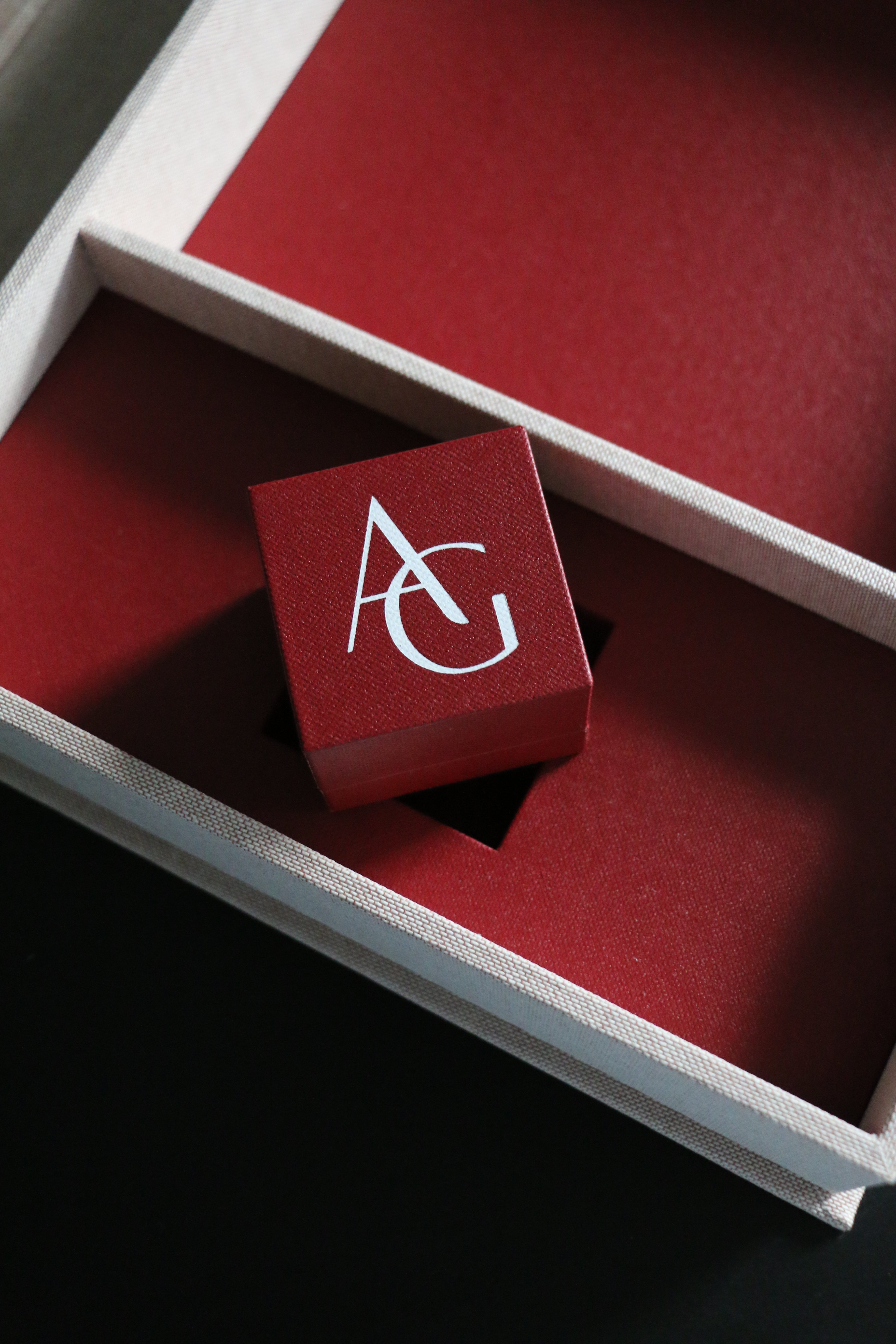 The ring box in it's presentation deed red storybox. Designed by London engagement ring designer; Antonia Guise
