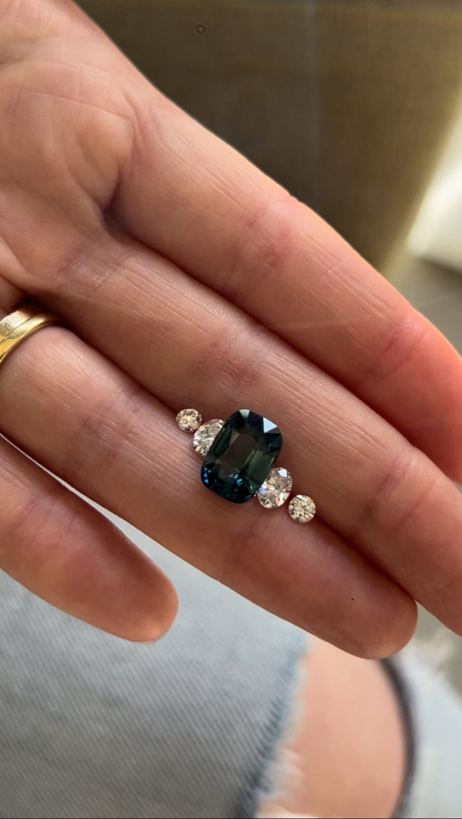 Natural Teal Sapphire with 4 diamonds. Sourced by Antonia Guise, the London jeweller for a bespoke engagement ring.