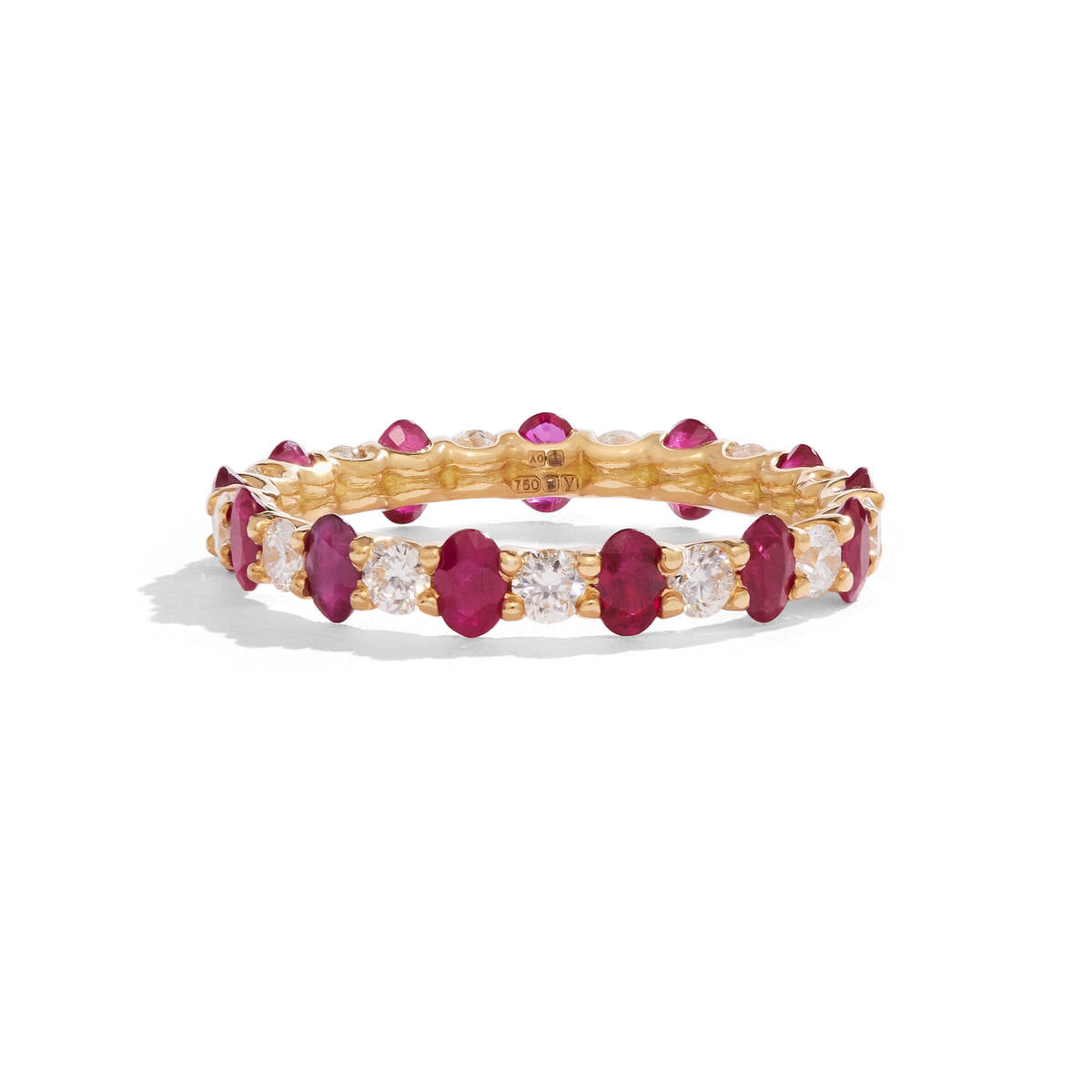 Image of oval Pink Ruby and round Diamond eternity band set in yellow gold on a white background