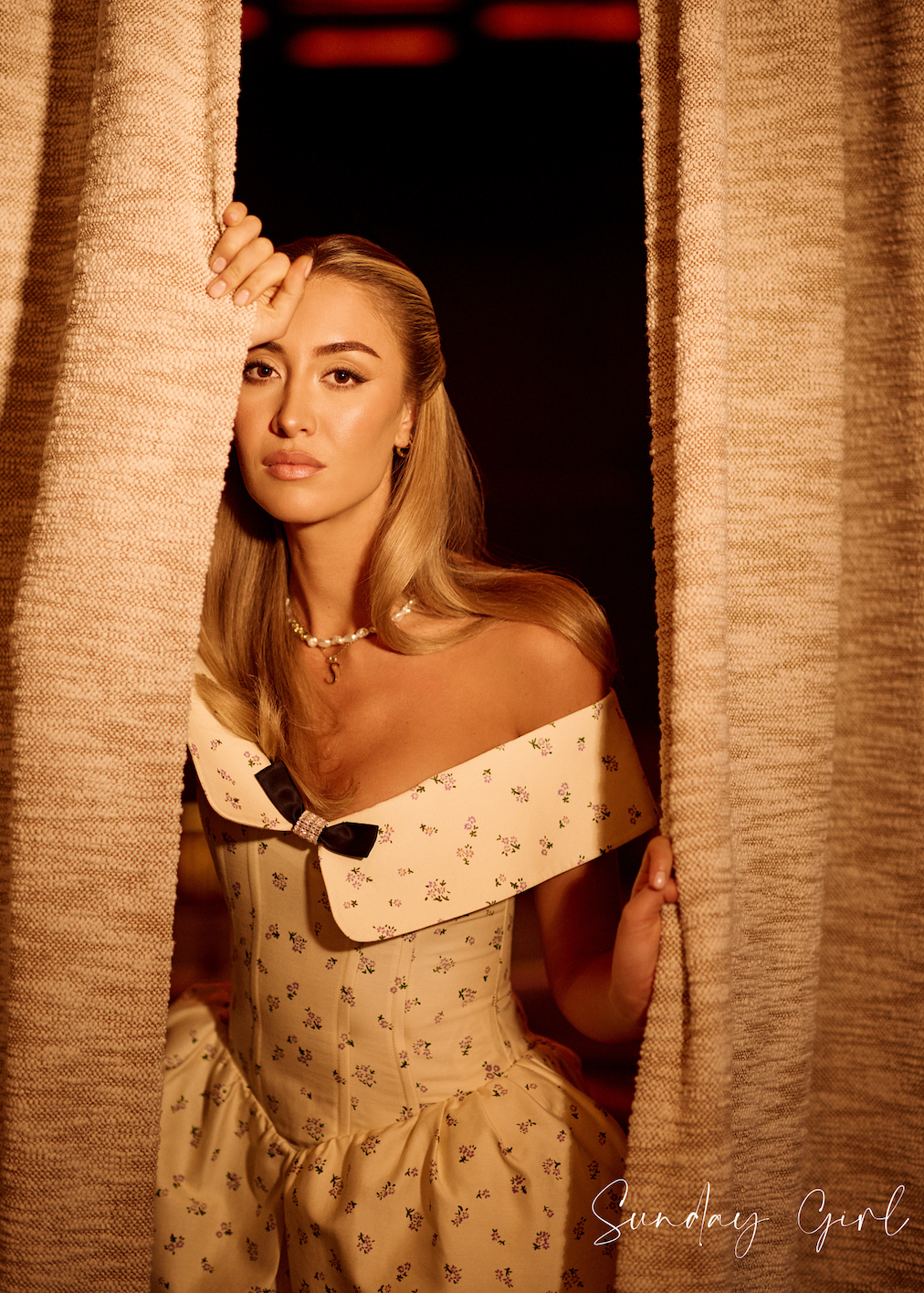 Image of Sophie Habboo wearing a yellow print off the shoulder dress and an Antonia Guise Anne S Necklace