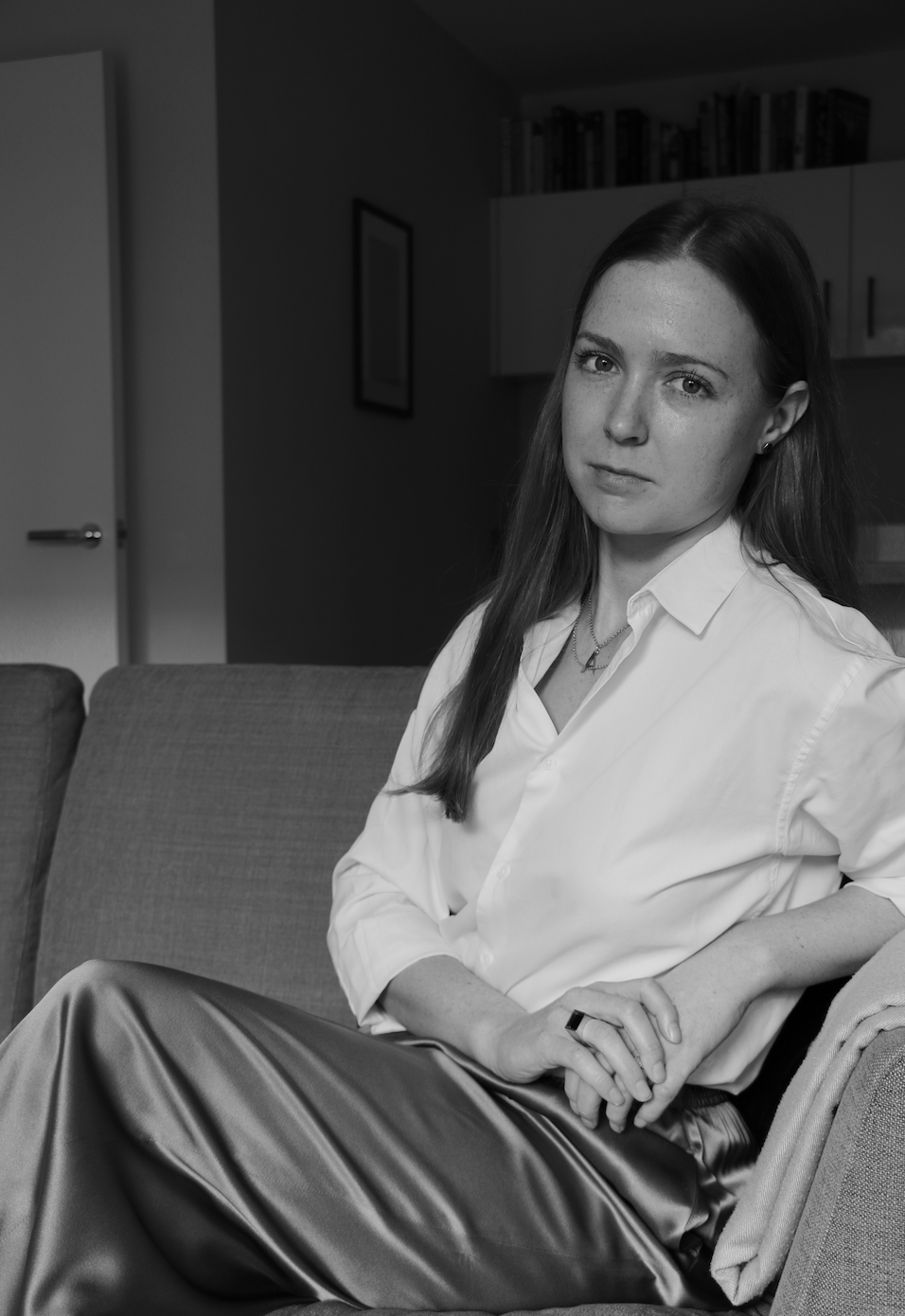 Portrait of Antonia the founder and designer at Antonia Guise wearing a white shirt and looking to camera