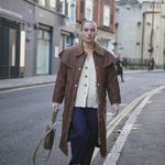 Video of model walking down Bermondsey Street wearing jeans and a wax jacket and our Mary Figaro Chain necklace in gold vermeil