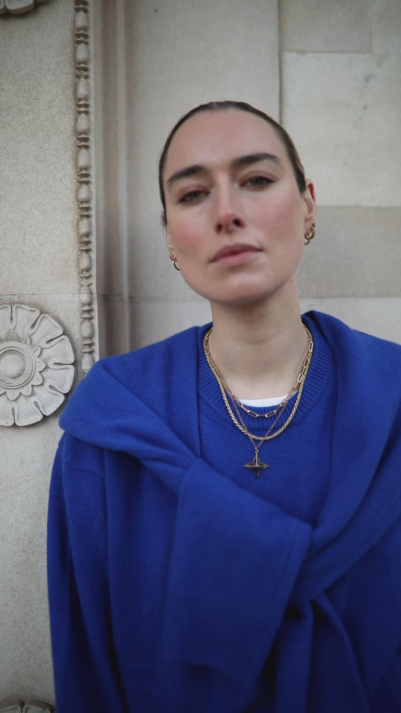 Video of model wearing bright blue jumper and our Jenny Trace Chain