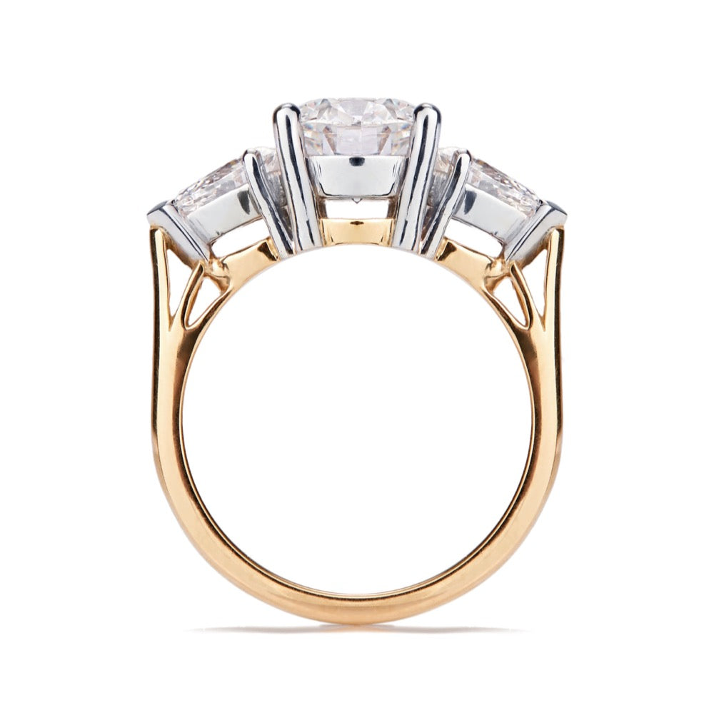 Profile view of Trilogy diamond ring with gallery detailing lying on a white background