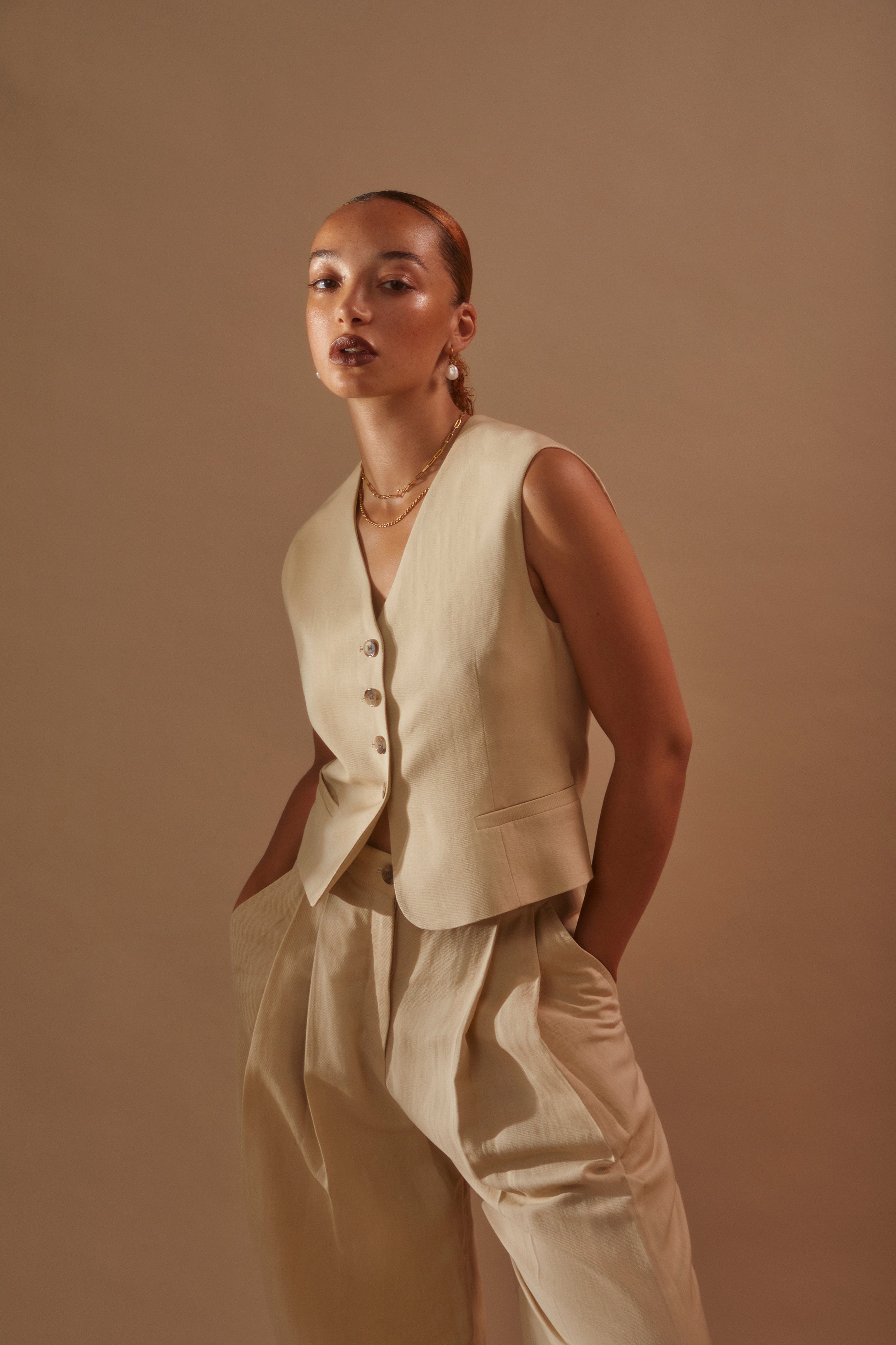Model wearing Rosalind + Jenny Layering set with beige linen suit