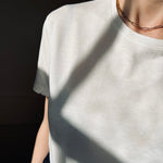 Our model wearing a white t-shirt wearing our Antonia Guise 16 inch Trace Chain