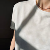 Our model wearing a white t-shirt wearing our Antonia Guise 16 inch Trace Chain