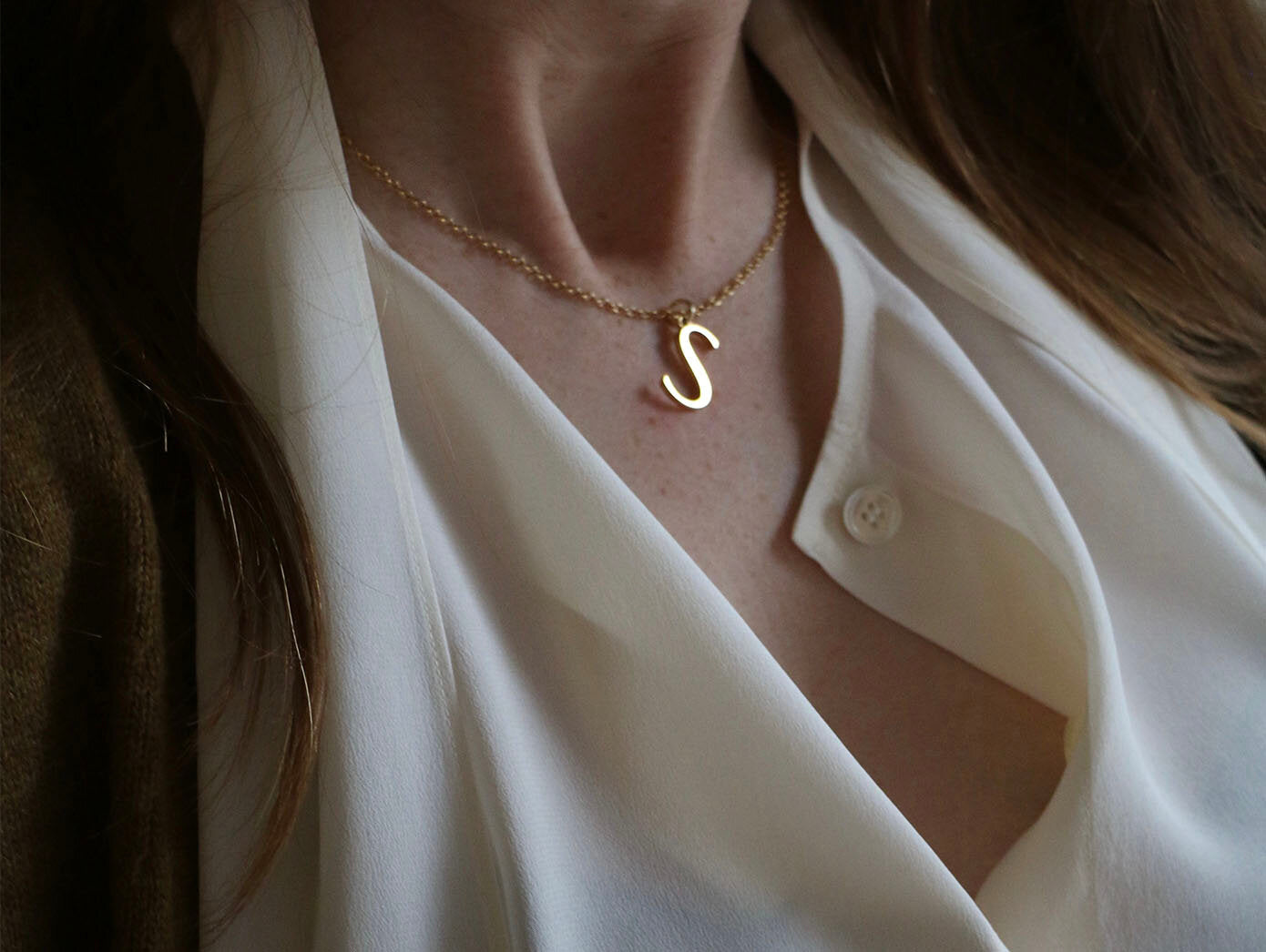  Close up of model wearing S Initial Necklace