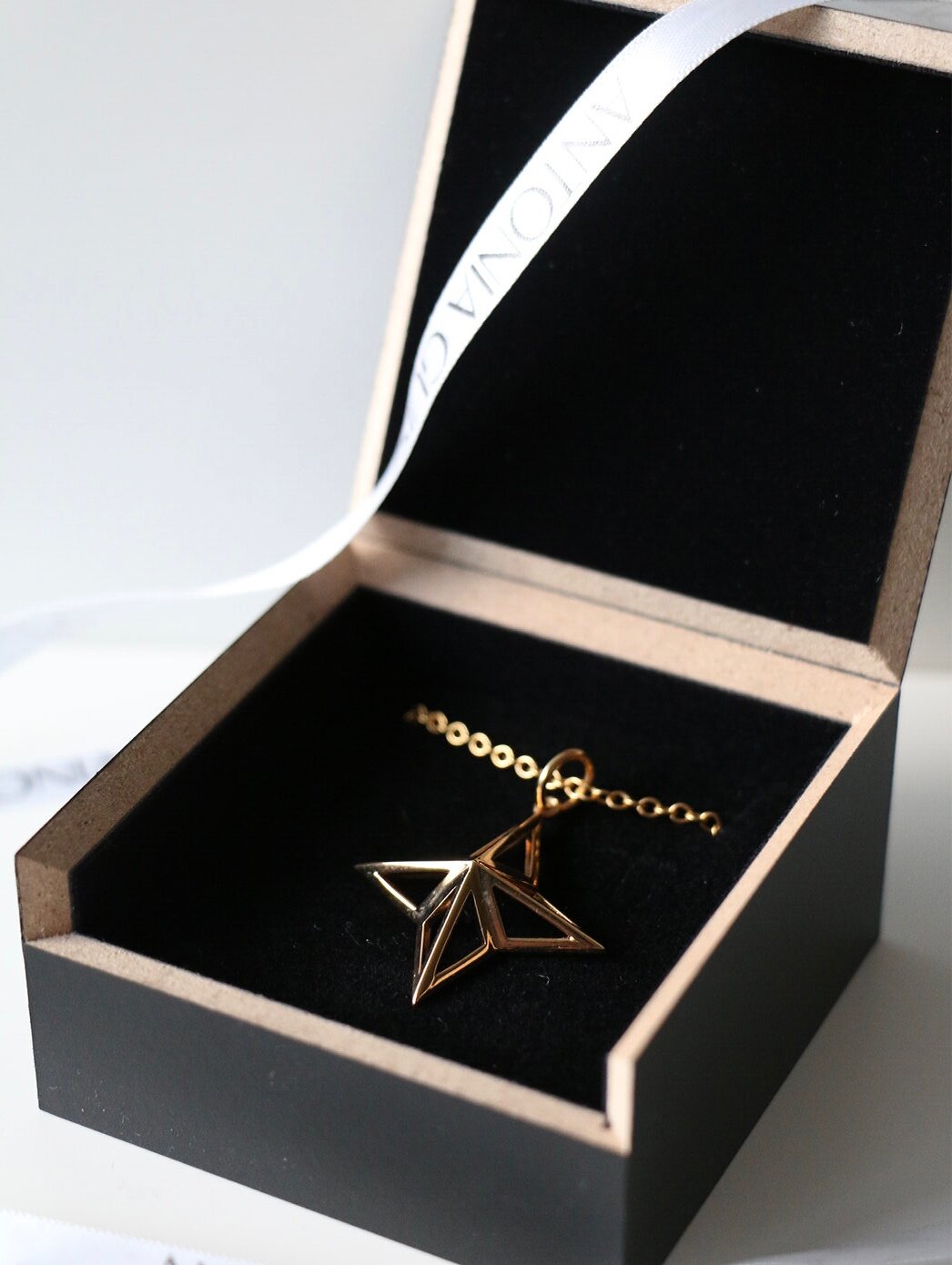 Our Theodora Necklace laid out in our recycled wooden presentation box